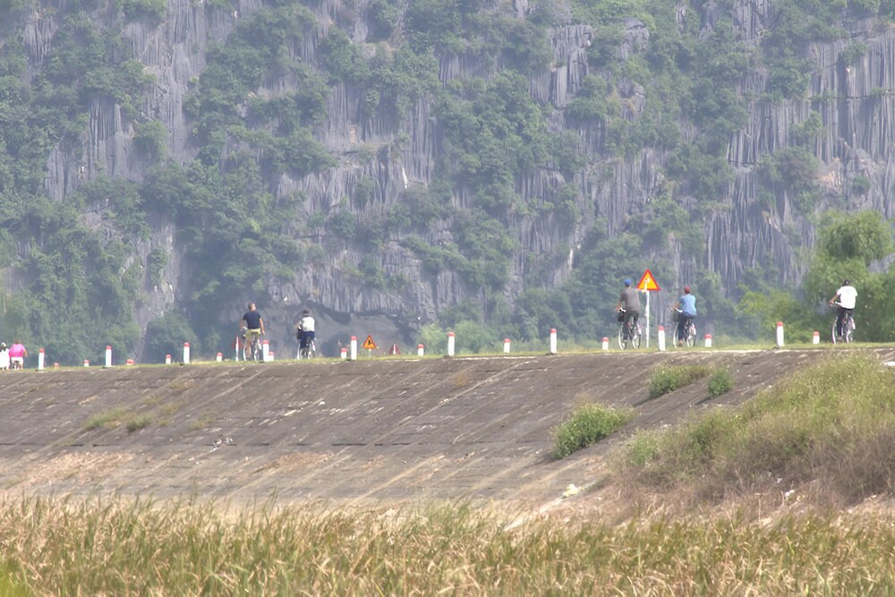 Cycling through villages and along the dikes is a wonderful way to experience the tranquil rhythm of Northern Vietnam